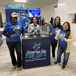 Group gathered indoors at a community wellness event